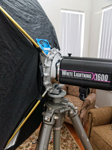 Photograph of OEC EZ Stand speed ring directly mounting to a tripod using its 3/8th inch bolt hole, with White Lightning x1600, atop Gitzo tripod for Peter Free review of the OEC speed ring.